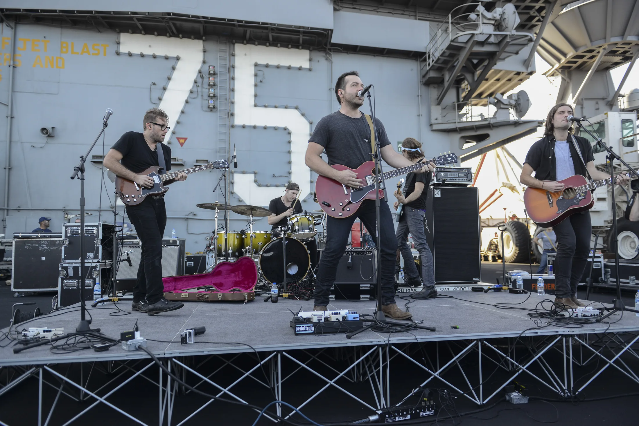 GULF OF OMAN (Dec. 12, 2013) The country band Mockingbird Sun performs a concert sponsored by Navy Entertainment on the flight deck of the aircraft carrier USS Harry S. Truman (CVN 75). Harry S. Truman, flagship for the Harry S. Truman Car