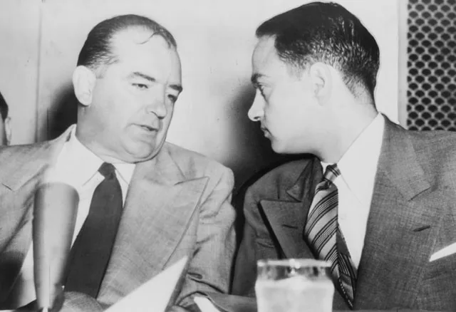 Sen. Joseph McCarthy chats with his attorney Roy Cohn during Senate Subcommittee hearings on the McCarthy-Army dispute