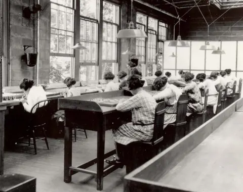 Radium Girls work in a factory of the United States Radium Corporation.