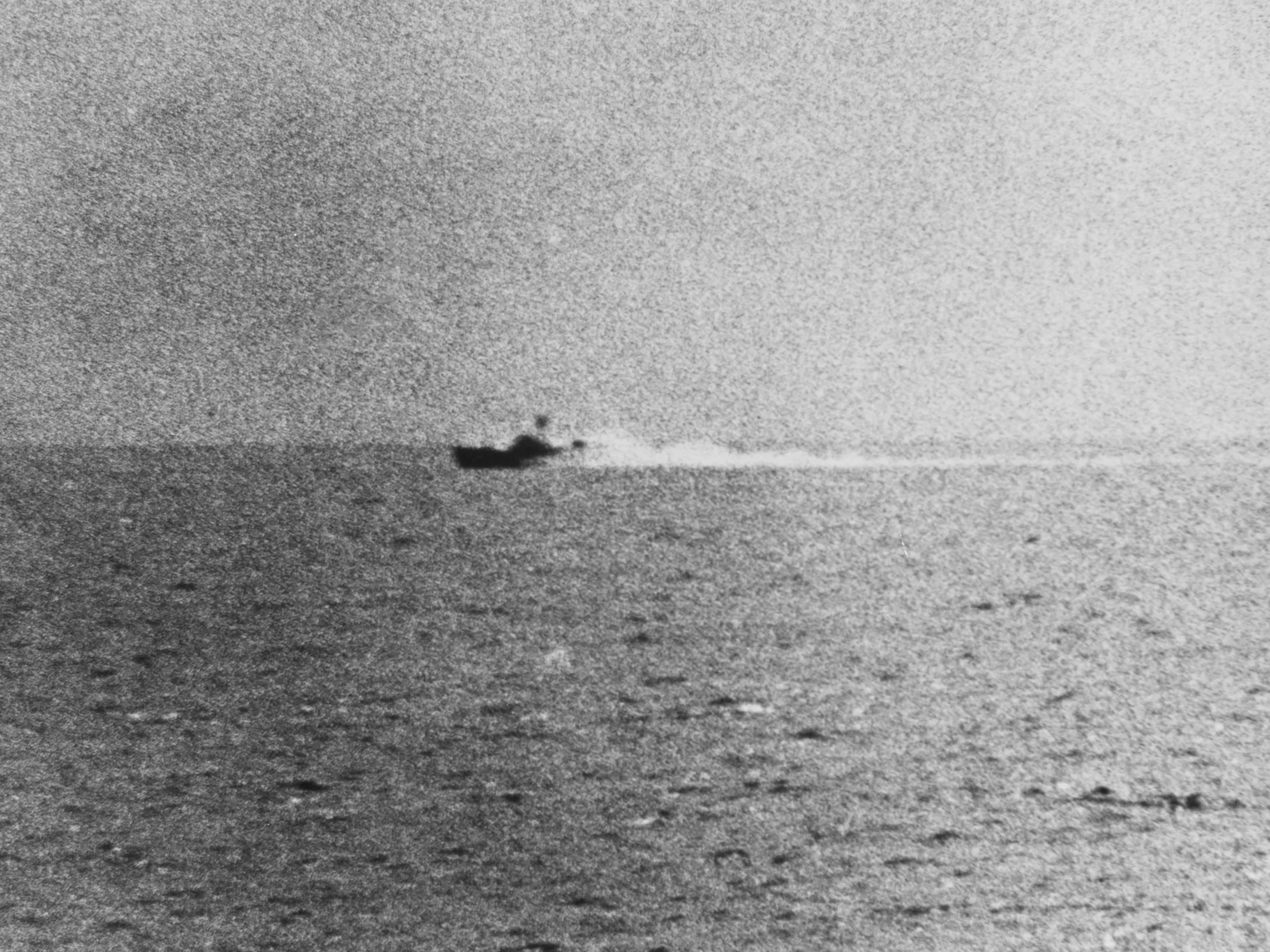 Tonkin Gulf Incident, August 1964: Photograph taken from the U.S. Navy destroyer USS Maddox (DD-731) during her engagement with three North Vietnamese motor torpedo boats in the Gulf of Tonkin, 2 August 1964. The view shows one of the boats