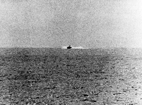 Tonkin Gulf Incident, August 1964: Photograph taken from the U.S. Navy destroyer USS Maddox (DD-731) during her engagement with three North Vietnamese motor torpedo boats in the Gulf of Tonkin, 2 August 1964. The view shows one of the boats
