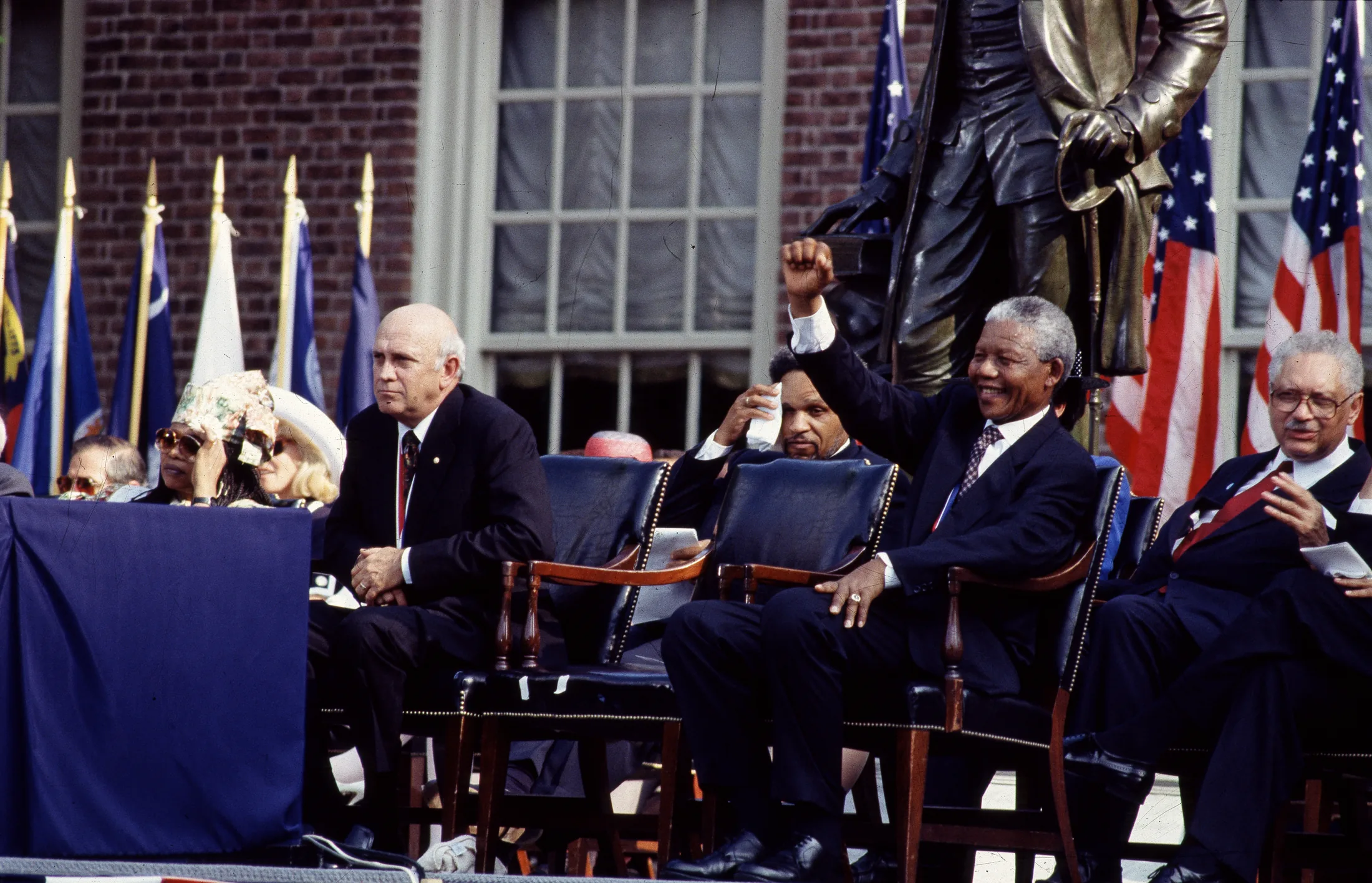Title: F.W. de Klerk, left, the last president of apartheid-era South Africa, and Nelson Mandela, his successor, wait to speak in Philadelphia, Pennsylvania
Physical description: 1 transparency : color ; 4 x 5 in. or smaller.
Notes: Digita