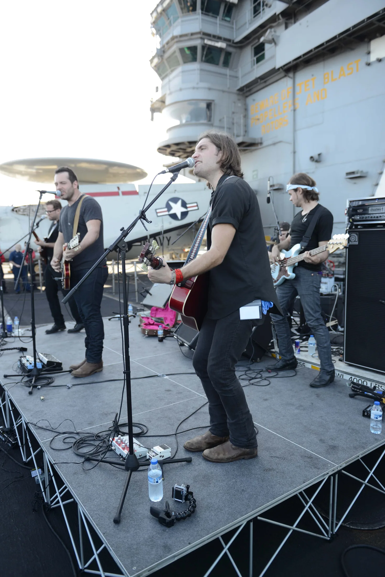 GULF OF OMAN (Dec. 12, 2013) The country band Mockingbird Sun performs a concert sponsored by Navy Entertainment on the flight deck of the aircraft carrier USS Harry S. Truman (CVN 75). Harry S. Truman, flagship for the Harry S. Truman Car