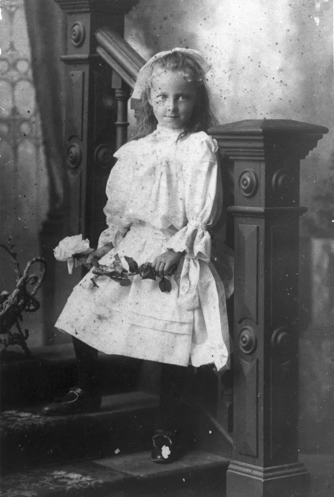 Portrait of Ivy Bell of Buderim, Queensland, 1908
Studio portrait of young girl Ivy Bell, posing on a staircase and holding a rose, at Buderim in 1908.